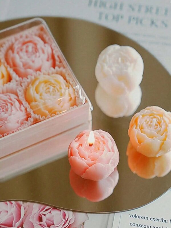 9602-b6f2gc.jpg Coffret de quatre bougies fleurs parfumées