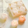 9602-ujbwxa.jpg Coffret de quatre bougies fleurs parfumées