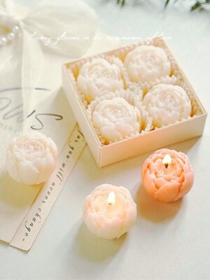 Coffret de quatre bougies fleurs parfumées